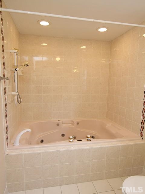 4500 Connell Drive Raleigh, NC 27612 - Photo 22 of 25 a bathroom with a bathtub and a shower