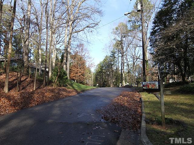 4500 Connell Drive Raleigh, NC 27612 - Photo 4 of 25 a view of a street with a yard
