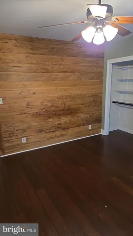 a view of a room with an empty space and a window