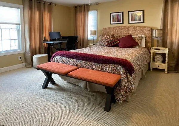 a bedroom with a bed and a table in it
