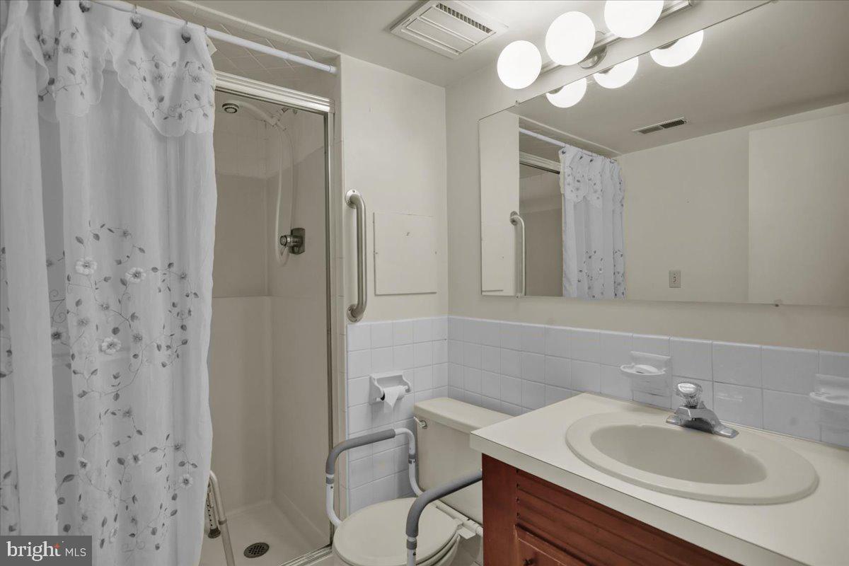 7 Fairway Road Reading, PA 19607 - Photo 13 of 20 a bathroom with a sink a toilet and shower