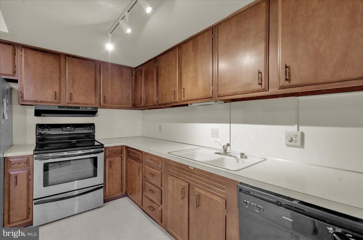 7 Fairway Road Reading, PA 19607 - Photo 4 of 20 a kitchen with stainless steel appliances granite countertop a sink stove and cabinets