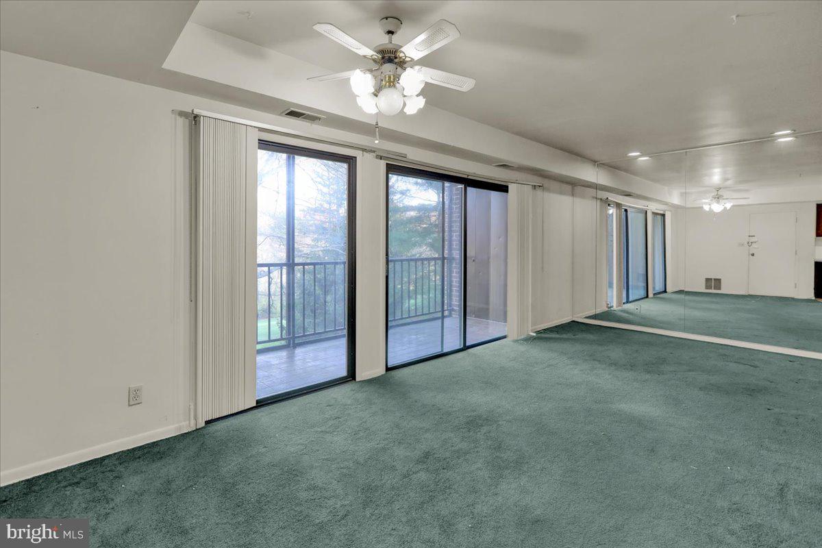 7 Fairway Road Reading, PA 19607 - Photo 7 of 20 an empty room with windows and ceiling fan