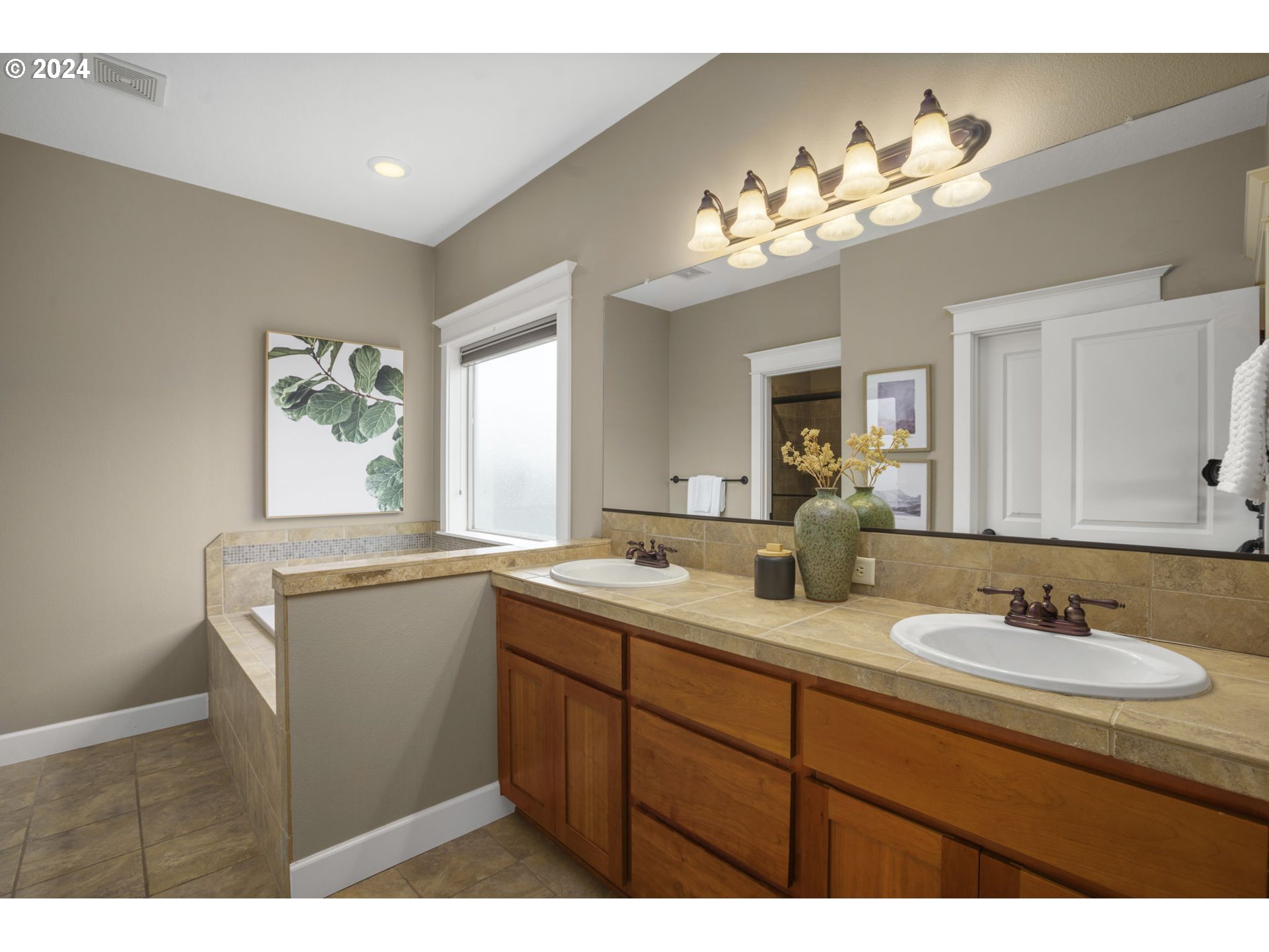 323 Southwest Carson Street Portland, OR 97219 - Photo 19 of 30 a bathroom with a sink vanity granite and a mirror