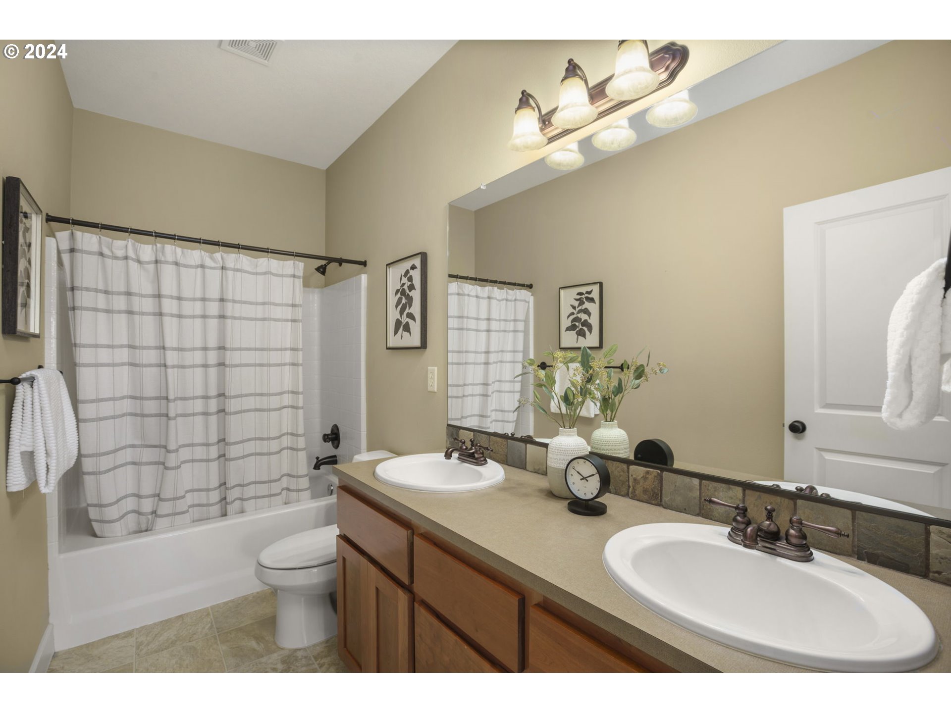 323 Southwest Carson Street Portland, OR 97219 - Photo 23 of 30 a bathroom with a sink a toilet and shower