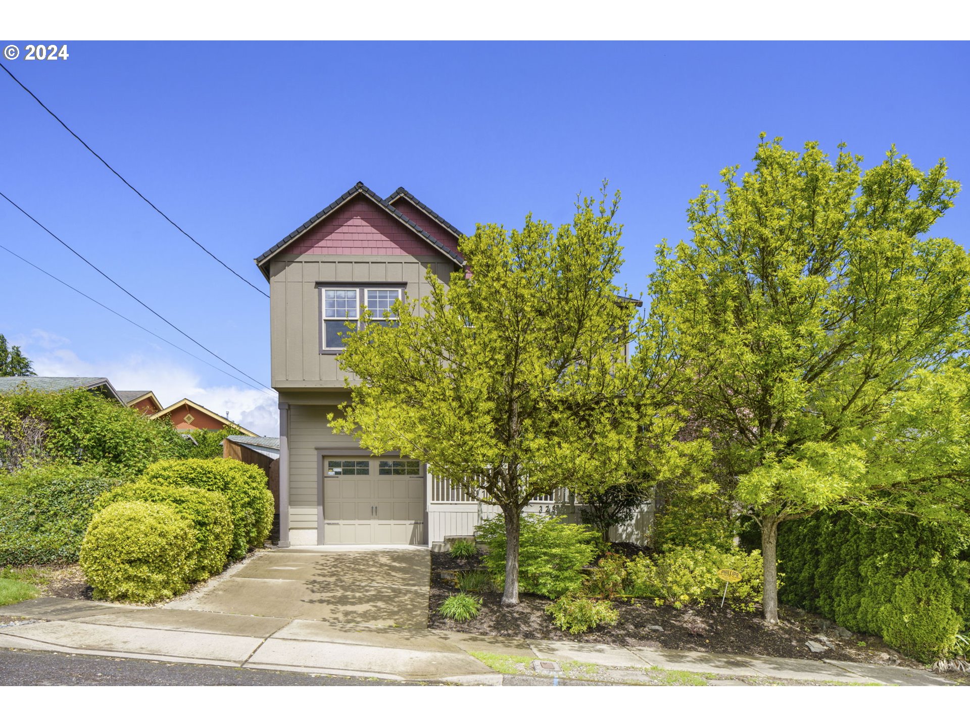 323 Southwest Carson Street Portland, OR 97219 - Photo 30 of 30 a view of a house with a yard and potted plants