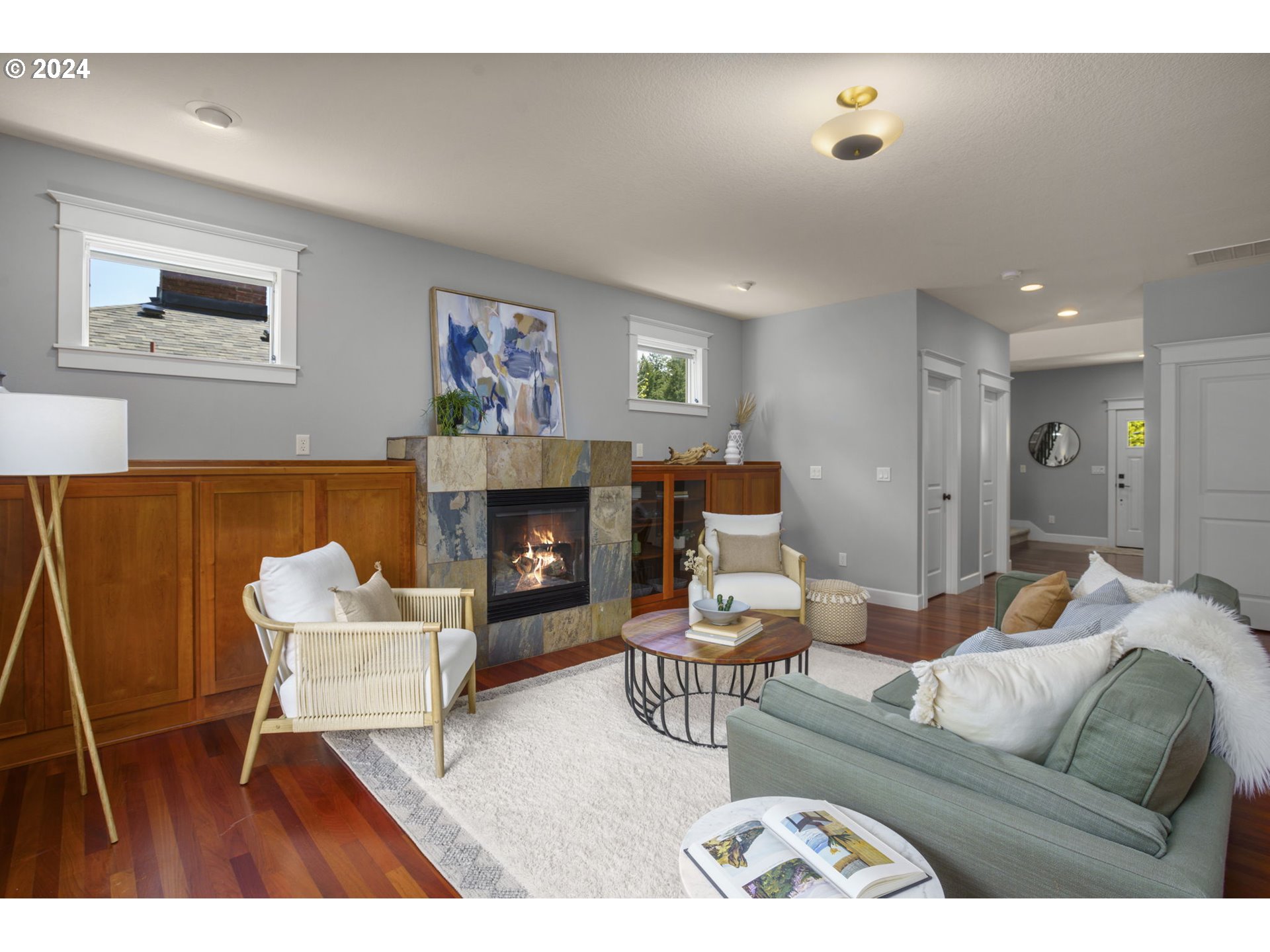 323 Southwest Carson Street Portland, OR 97219 - Photo 6 of 30 a living room with furniture and a fireplace