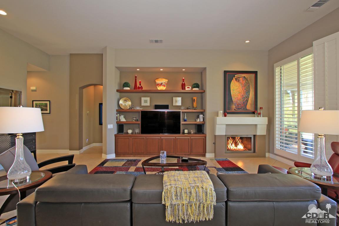 255 Loch Lomond Road Rancho Mirage, CA 92270 - Photo 8 of 32 a living room with furniture and a fireplace