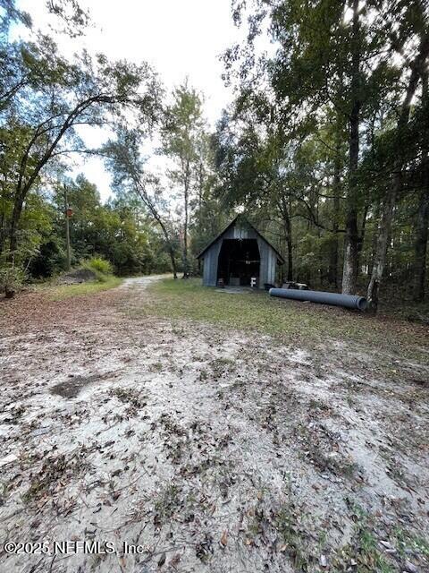 54847 Church Road Callahan, FL 32011 - Photo 11 of 15 a view of a outdoor space with trees