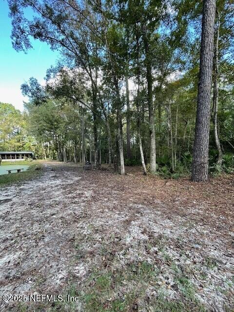 54847 Church Road Callahan, FL 32011 - Photo 4 of 15 a view of outdoor space with deck and yard