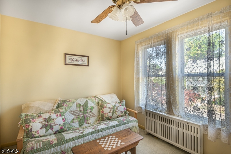 63 Main Street Bloomsbury, NJ 08804 - Photo 13 of 26 a bedroom with furniture and a window