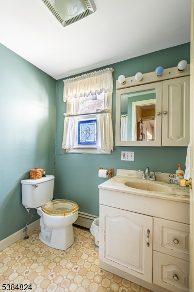 63 Main Street Bloomsbury, NJ 08804 - Photo 18 of 26 a bathroom with a toilet sink and mirror