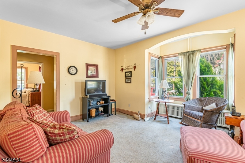 63 Main Street Bloomsbury, NJ 08804 - Photo 2 of 26 a bedroom with furniture and a large window