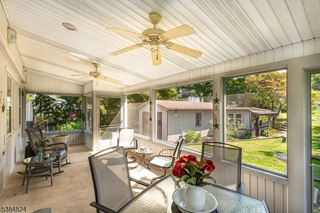 a view of a patio with couches chairs and potted plants