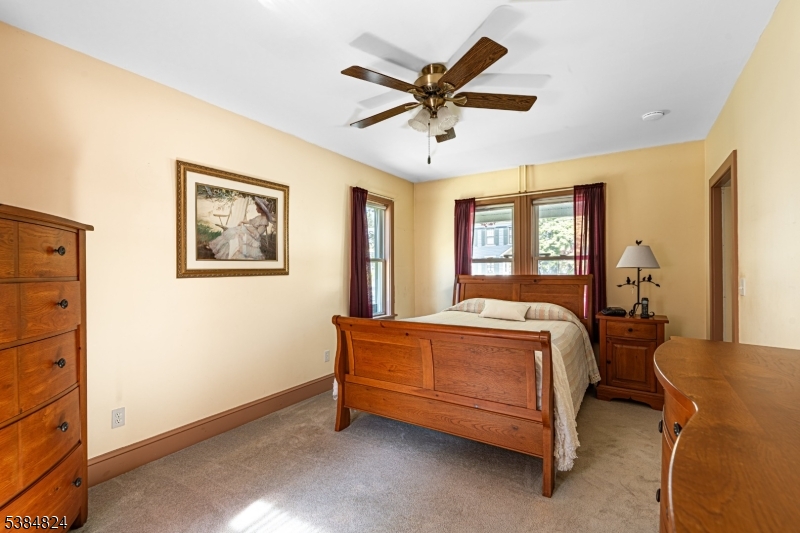 63 Main Street Bloomsbury, NJ 08804 - Photo 5 of 26 a bed sitting in a bedroom next to a window