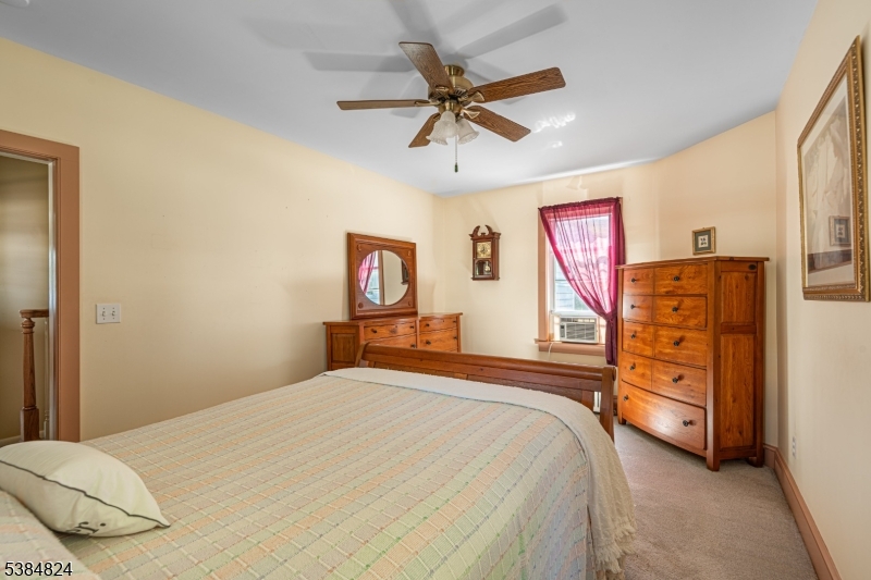 63 Main Street Bloomsbury, NJ 08804 - Photo 6 of 26 a bedroom with a bed and a closet