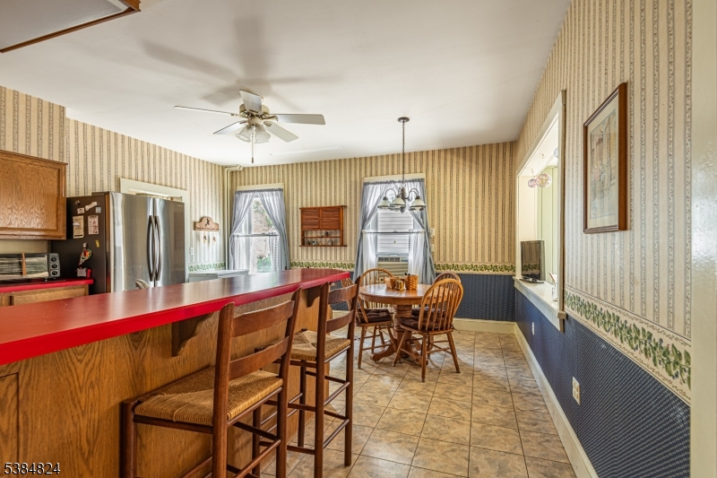 63 Main Street Bloomsbury, NJ 08804 - Photo 9 of 26 a view of a dining room with furniture window and wooden floor