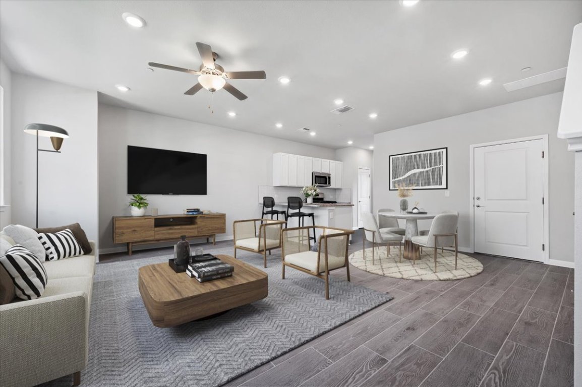 9015 Cattle Baron Path, Unit 1303 Austin, TX 78747 - Photo 2 of 14 a living room with furniture and a flat screen tv