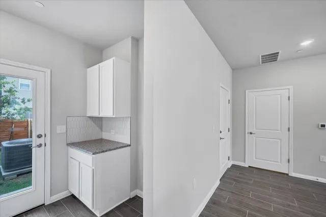 a bedroom with a bed and a potted plant