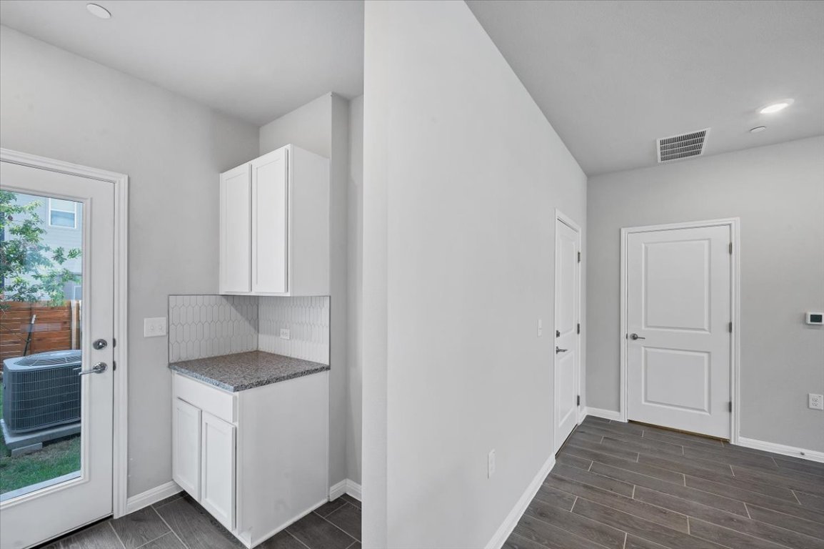 9015 Cattle Baron Path, Unit 1303 Austin, TX 78747 - Photo 6 of 14 a kitchen with a refrigerator and window