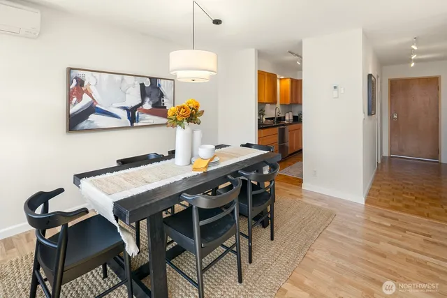 a view of a dining room with furniture and wooden floor