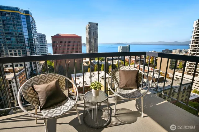 a city view from a balcony with city view