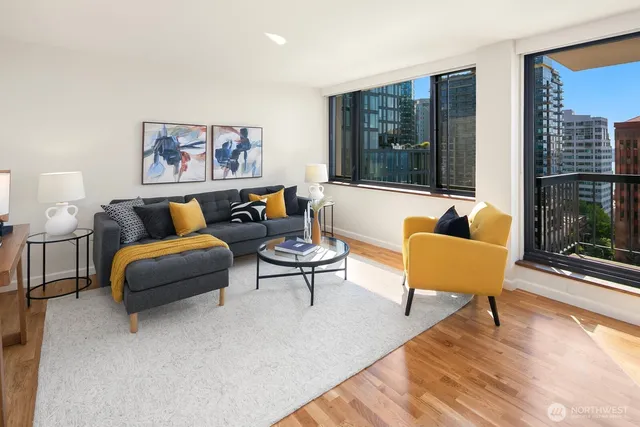 a living room with furniture and a large window