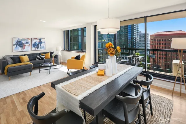 a dining room with furniture a chandelier and wooden floor