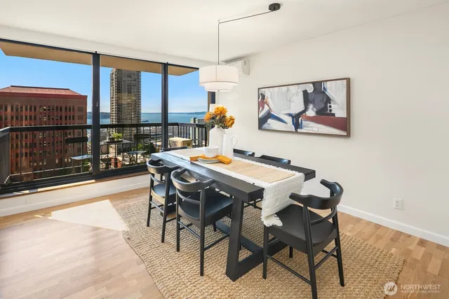 a dining room with furniture and window
