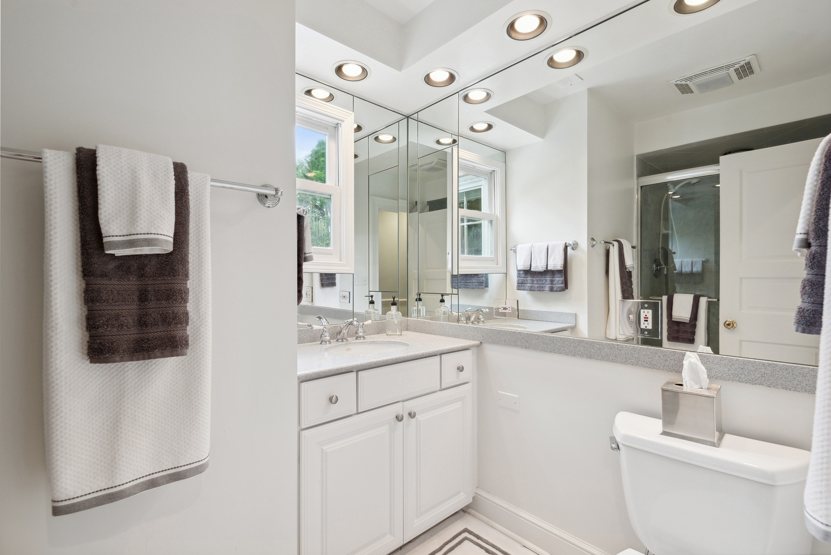 1335 Ridge Road Wilmette, IL 60091 - Photo 23 of 36 a bathroom with a granite countertop sink mirror vanity and toilet