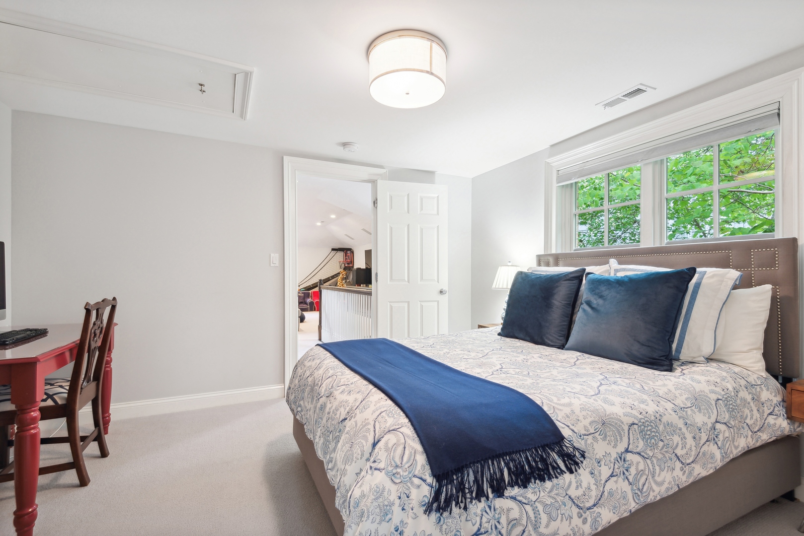 1335 Ridge Road Wilmette, IL 60091 - Photo 25 of 36 a bedroom with a bed and a chandelier