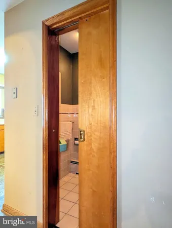 a view of a storage & utility room with refrigerator and a stove