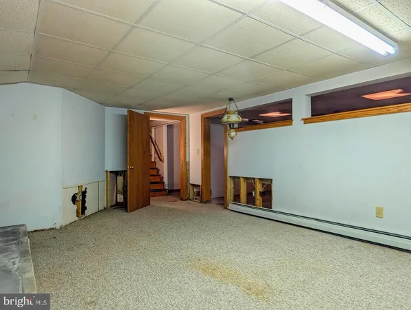 a view of a kitchen with a refrigerator a sink and dishwasher a refrigerator with wooden floor