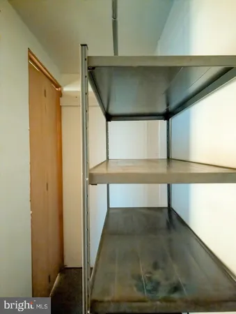 a view of bathroom with tub and shower