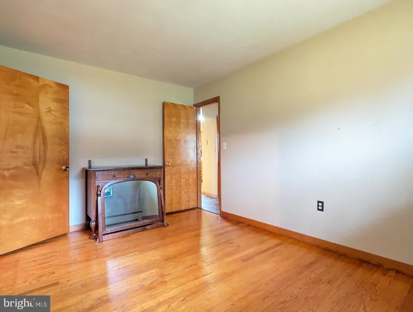 swimming pool view with a garden view