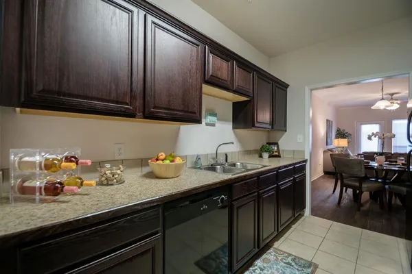 a kitchen with sink and cabinets