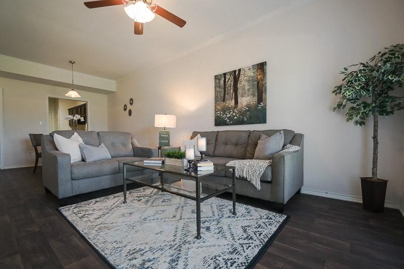380 Solon Road Waxahachie, TX 75165 - Photo 7 of 12 a living room with furniture and a potted plant