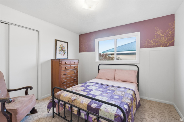 165 Main Street Georgetown, ID 83239 - Photo 16 of 50 Bedroom featuring a closet and wainscoting