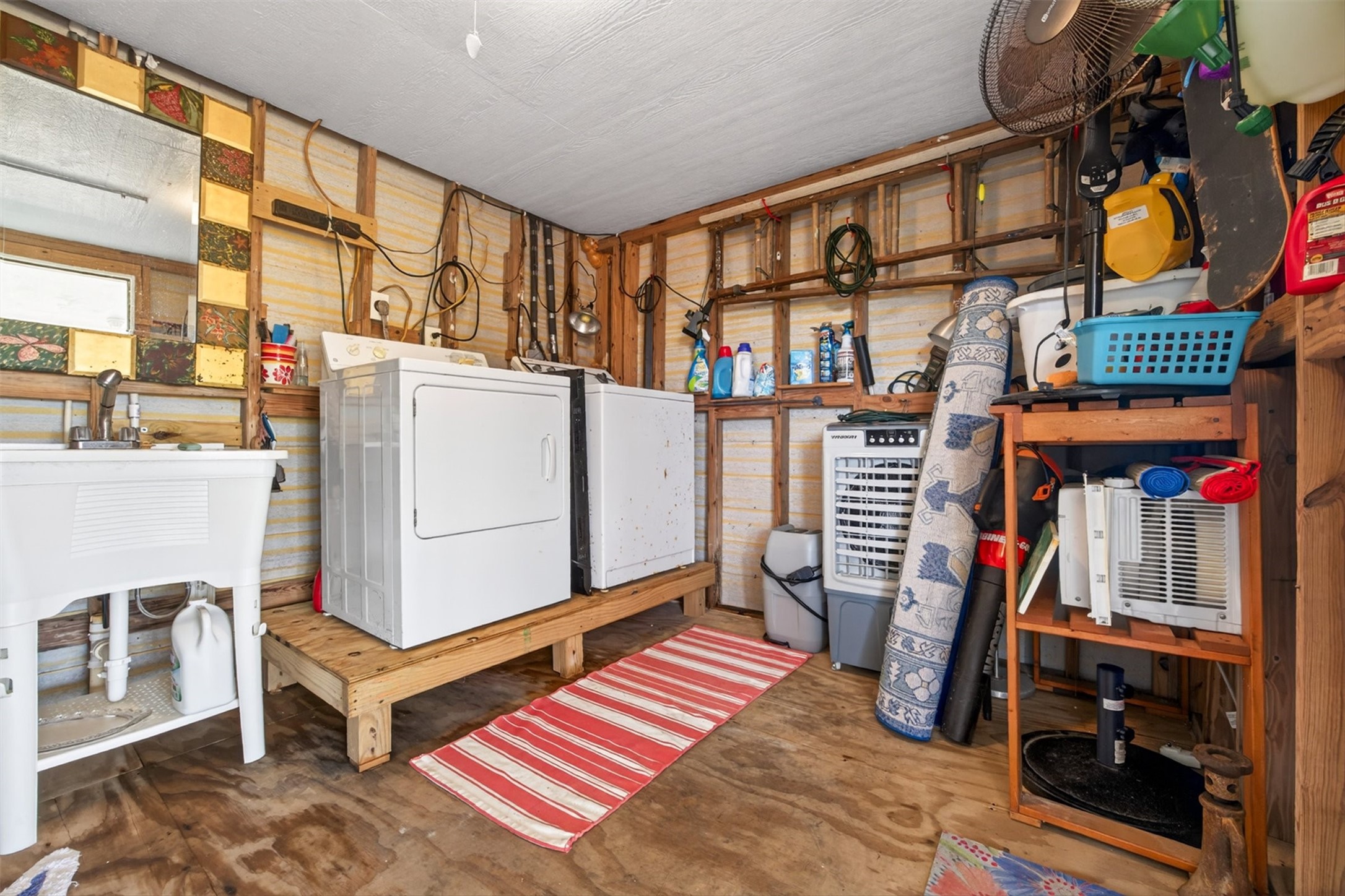 1209 North Jacks Road Crystal Beach, TX 77650 - Photo 27 of 39 Practical utility space with room for all the extras—store your gear, tackle, and beach essentials with ease.