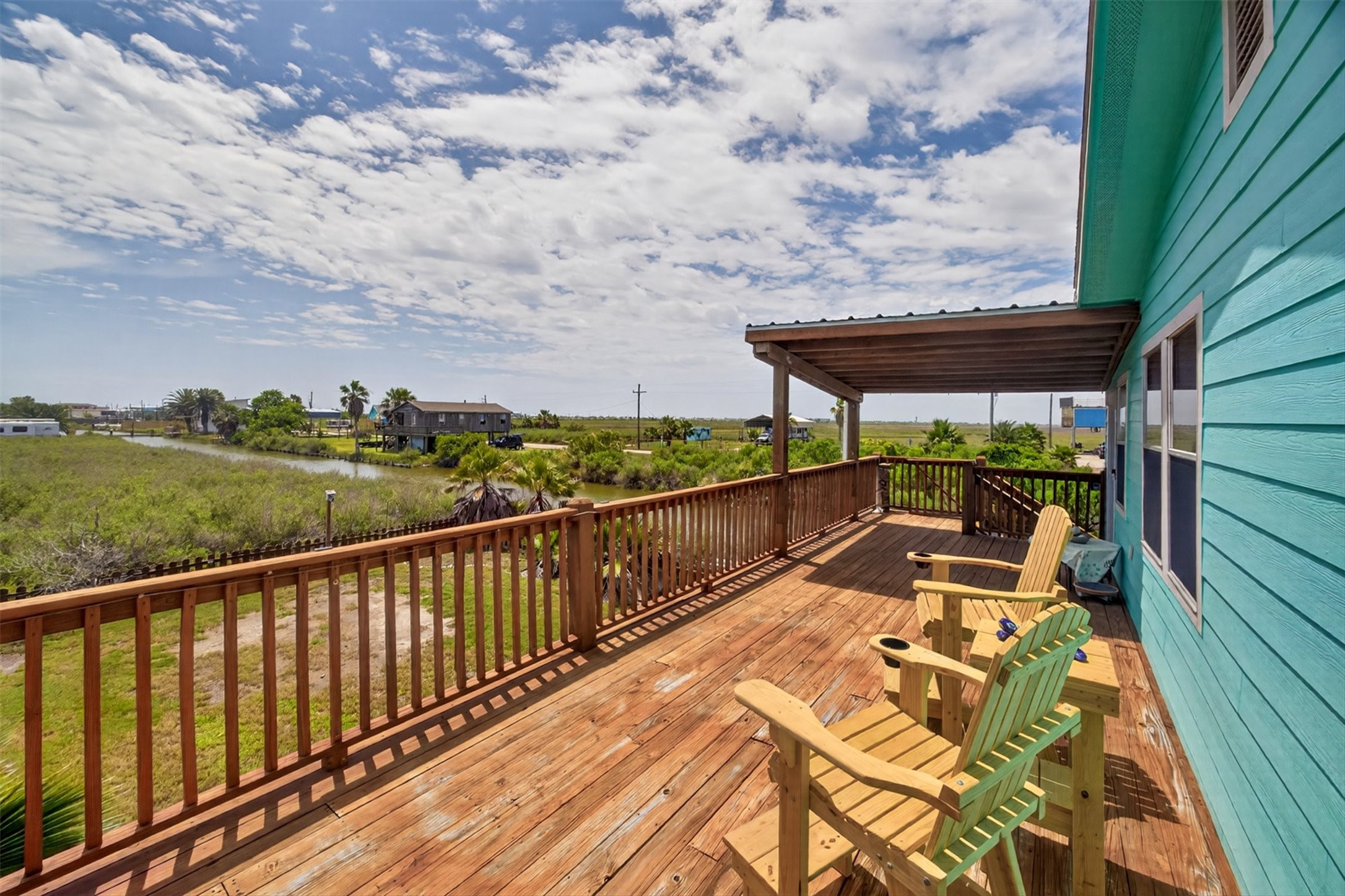 1209 North Jacks Road Crystal Beach, TX 77650 - Photo 3 of 39 Start your mornings with coffee and end your evenings with sunset skies—this oversized deck is made for relaxing, entertaining, and soaking in the coastal breeze.