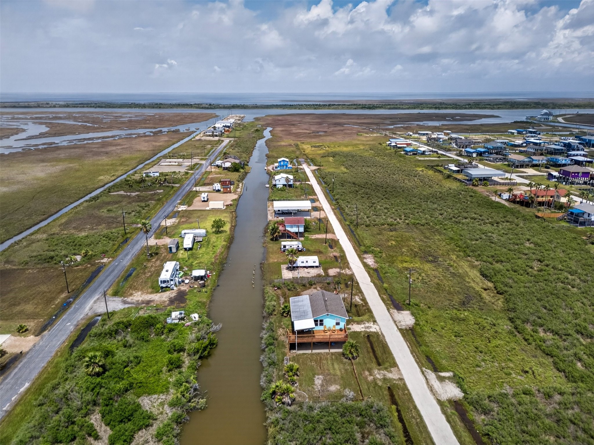 1209 North Jacks Road Crystal Beach, TX 77650 - Photo 31 of 39 Wide aerial view illustrating the property’s location within a canal-lined community just moments from open coastal waters.