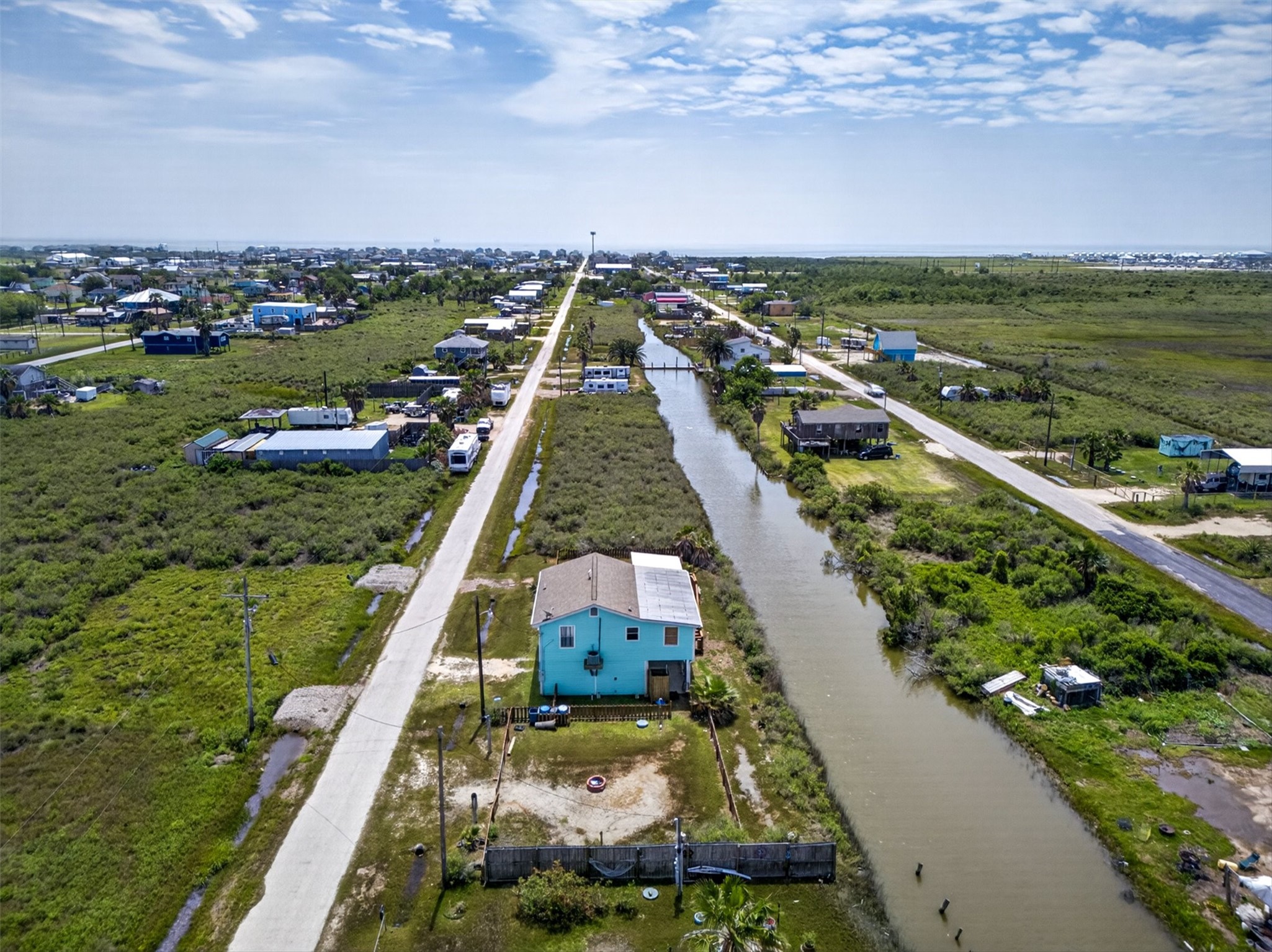 1209 North Jacks Road Crystal Beach, TX 77650 - Photo 33 of 39 An aerial view from the back of the property showcasing the extra lot, fully fenced!