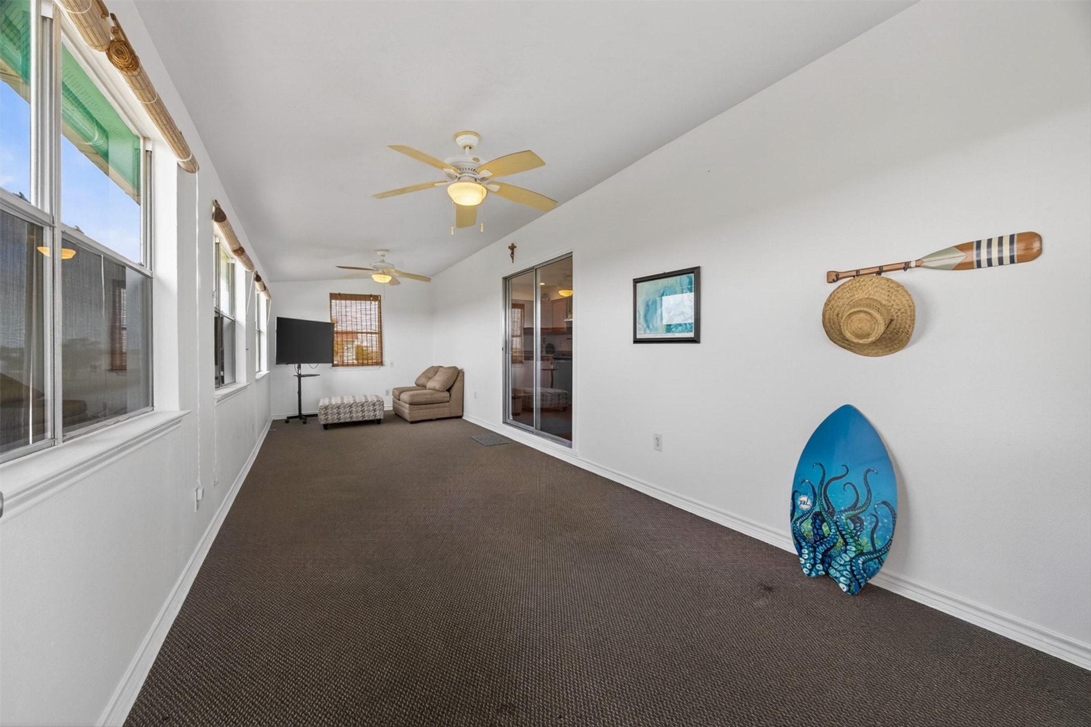 1209 North Jacks Road Crystal Beach, TX 77650 - Photo 6 of 39 Bright and versatile bonus space—perfect for additional lounging, game room, or extra sleeping space for guests (hello STR potential ??).