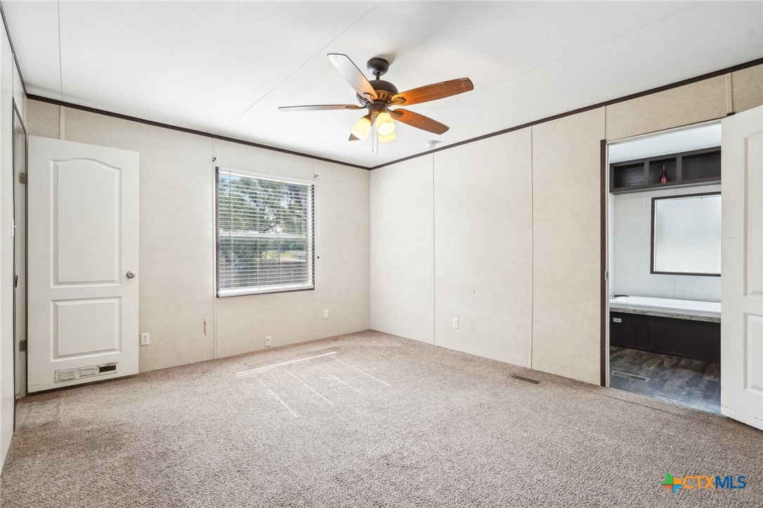 151 Deer River Drive Spring Branch, TX 78070 - Photo 15 of 29 a view of an empty room with a window