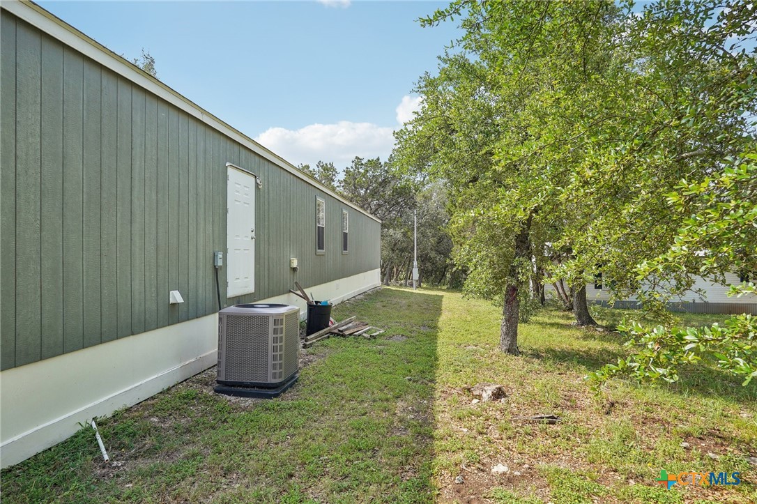 151 Deer River Drive Spring Branch, TX 78070 - Photo 27 of 29 a house view with a backyard space