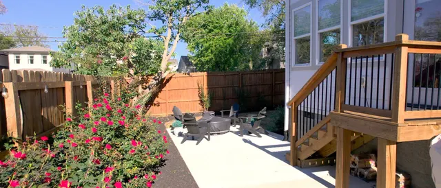 a kitchen with stainless steel appliances granite countertop a sink a stove a refrigerator a center island a stove and a cabinets