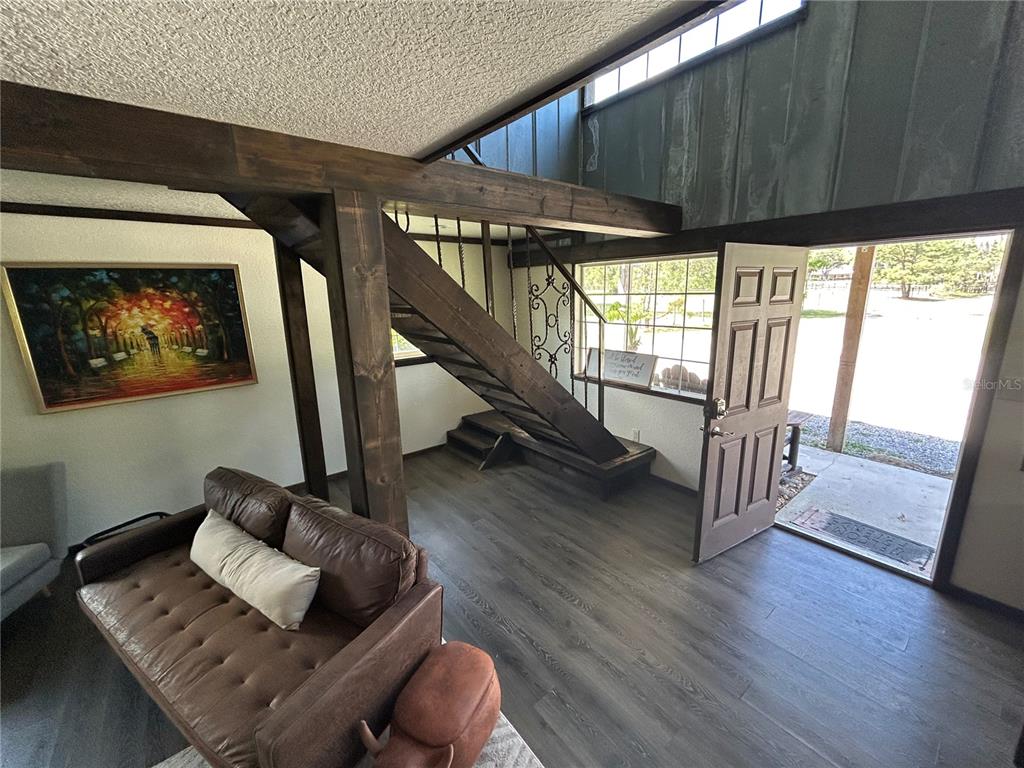 15455 Northwest 100th Avenue Road Reddick, FL 32686 - Photo 5 of 10 a living room with wooden floor and furniture