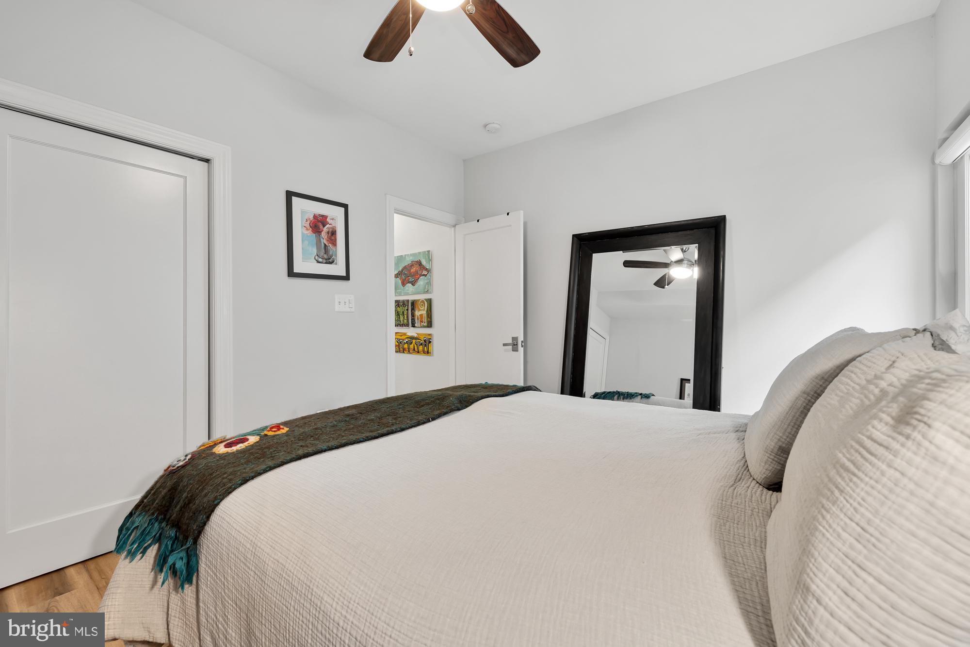 819 D Street Northeast, Unit 8 Washington, DC 20002 - Photo 20 of 26 a bedroom with a bed and painting on the wall