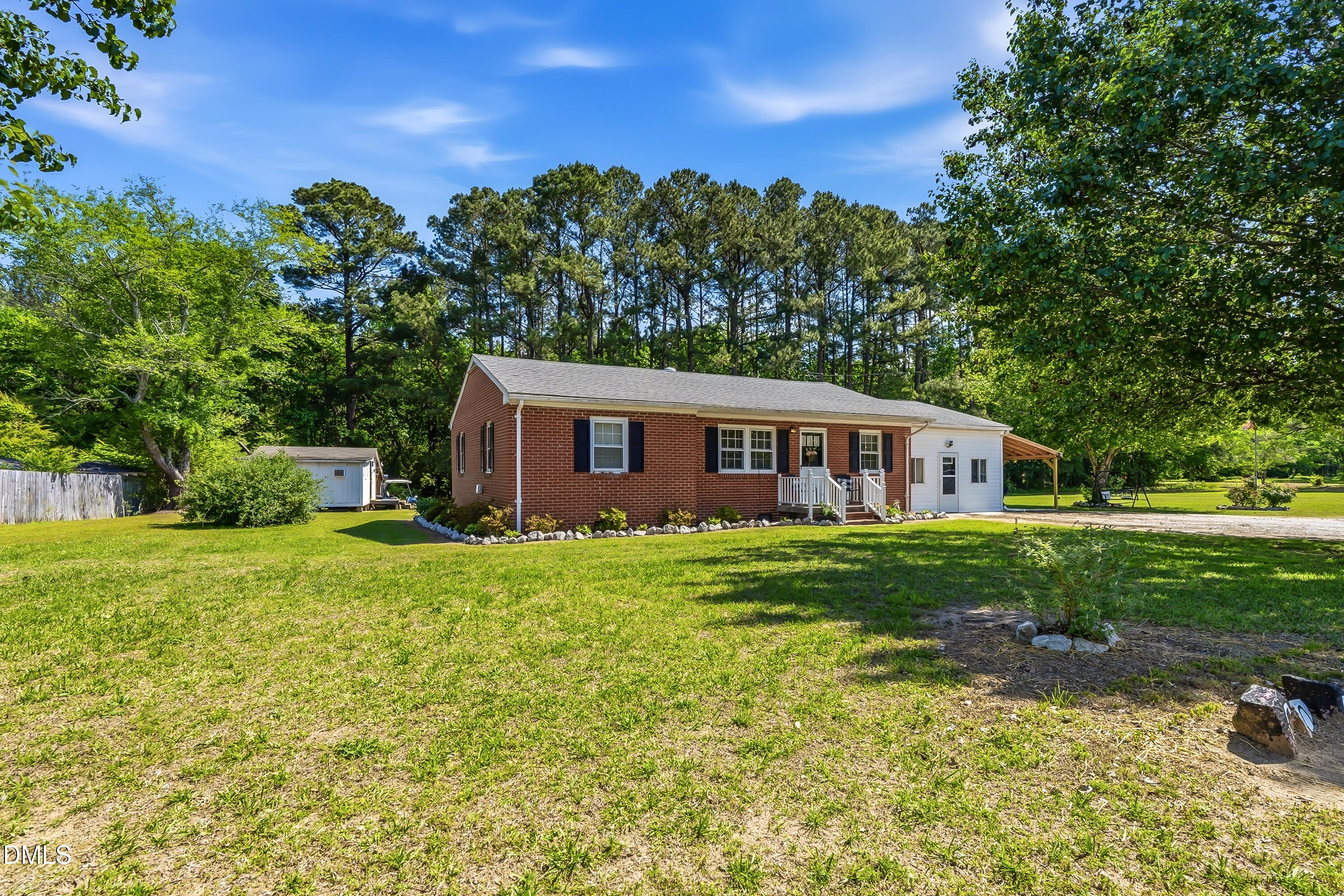 4967 Highway 581 Spring Hope, NC 27882 - Photo 6 of 44 a front view of a house with garden