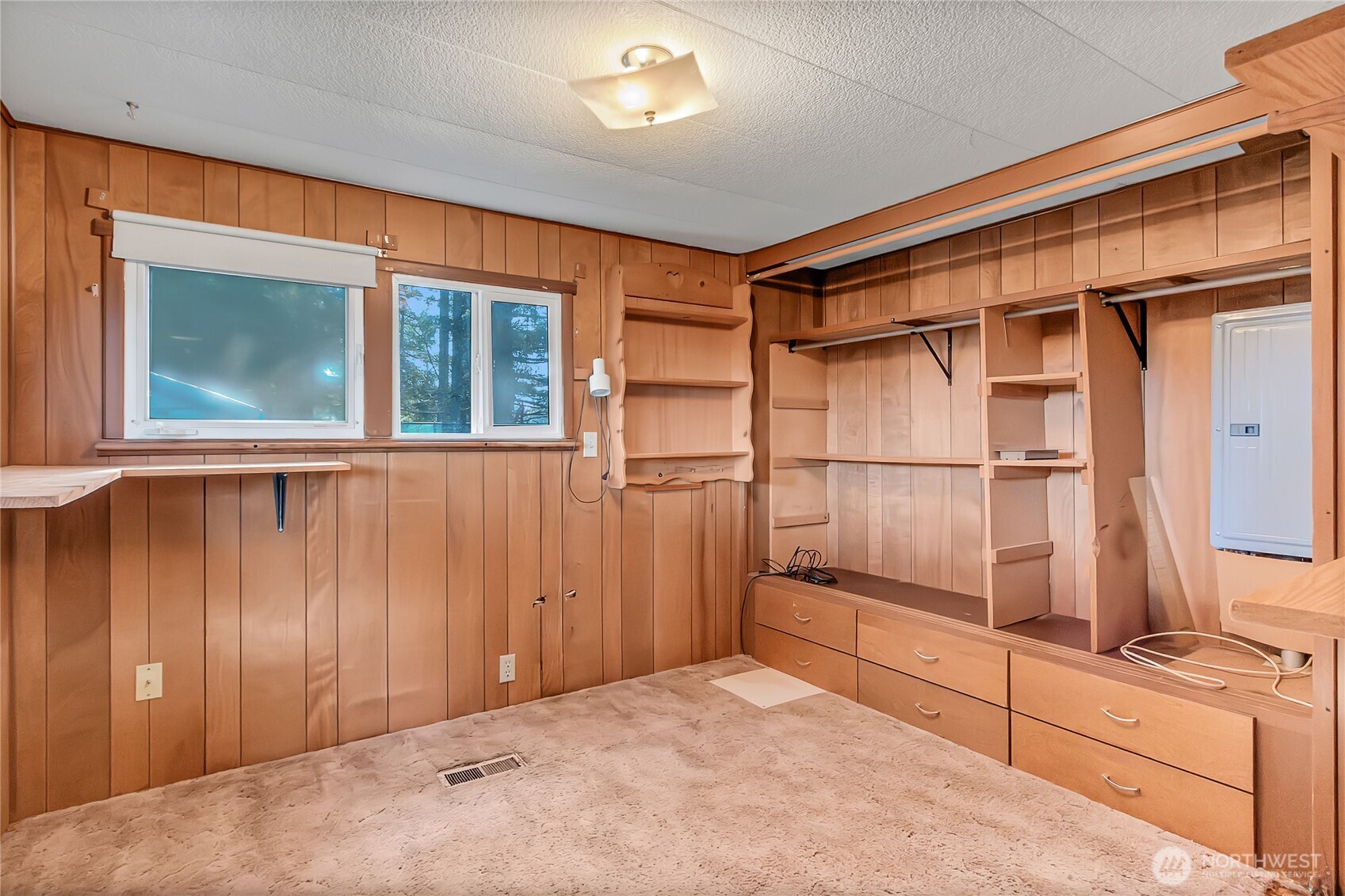 9314 Canyon Road East, Unit 34 Puyallup, WA 98371 - Photo 14 of 18 a view of an empty room with cabinet